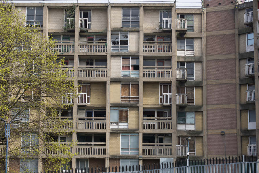A run-down apartment building. New research shows long-term benefits of antipoverty policies in areas of concentrated poverty. 